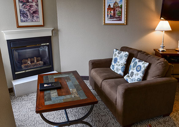 Relax by the glow of a fire while sinking into our comfy love seat.
