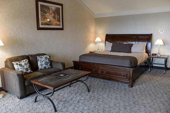 Our king spa suite has a comfy king size with love seat and coffee table.